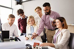 business team discussing house project at office business team discussing house project at office
